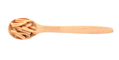 Wooden spoon with raw pasta on white background