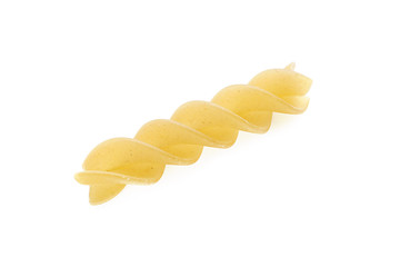 Raw spiral pasta on white background