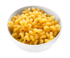 Bowl with raw pasta on white background