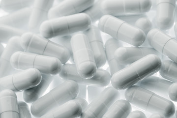 White pills capsules. Medicine and pharmacy concept.