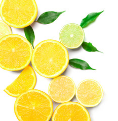 Composition of delicious citrus fruits and green leaves on white background