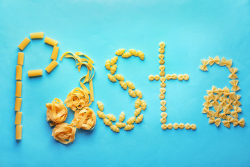 Obraz premium Flat lay composition with different uncooked pasta on color background