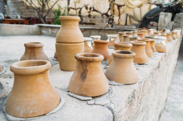 Fototapeta na wymiar closeup shot of clay jugs placed in row in Cappadocia, Turkey