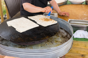 Person making traditional Turkish gozleme