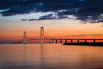 Fototapeta na wymiar The great belt bridge (storebæltsbroen) in Denmark at sunset