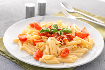 Plate of delicious pasta with bolognese sauce on table
