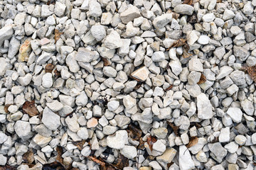 Abstract texture of white-gray gravel and crushed stone