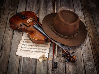Still life with hat, violin and coins