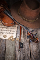 Still life with hat, violin and coins