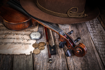 Still life with hat, violin and coins