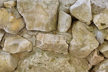 masonry stone wall of large stone limestone