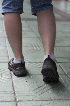 Male Legs In Sneakers View From Behind, Traveling, Walking