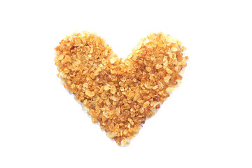 Natural brown sugar or no bleach sugar on white isolated background with heart shape in top view flat lay with copy space. Sweet seasoning for good health. Ingredient prepared for cooking or bakery