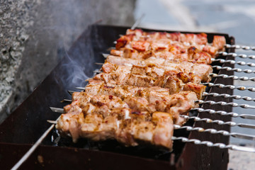 A delicious barbecue is prepared on charcoal grill