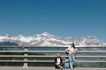beautiful young women resting near fence in majestic snow-capped mountains, mont blanc, alps © LIGHTFIELD STUDIOS