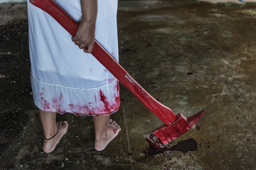 Zombie woman hand holding bloody axe © sorapop