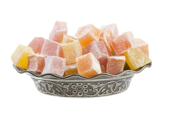 Turkish delight in vintage plate isolated on white background.