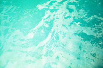 Background of rippled water in swimming pool