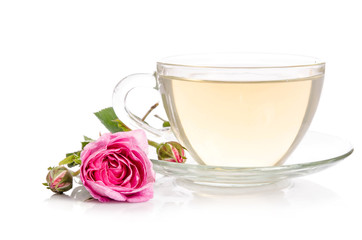 Glass cup of Tea with rose isolated on white background