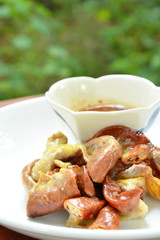 grilled pork fillet slice with spicy sauce on plate