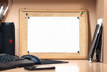 A cork board with a white sheet of paper. Background for mockup.