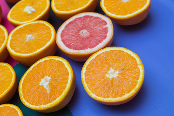 Fototapeta premium oranges cut into a color texture