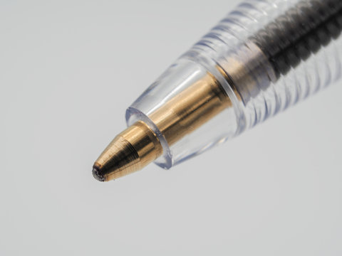 A high resolution macro image of the tip of a ballpoint pen.