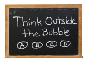 Think outside the bubble written in white chalk on a black chalkboard isolated on white