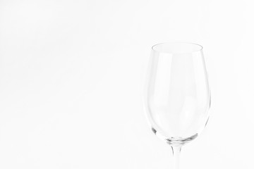 Empty wine glass on a white background with copy space