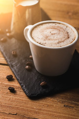 Black coffee with milk flatlay view on wooden background