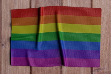 LGBTQ Flag over wooden background - 3d Rendering