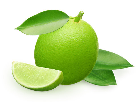 Lime fruit with slice and green leaves isolated on white
