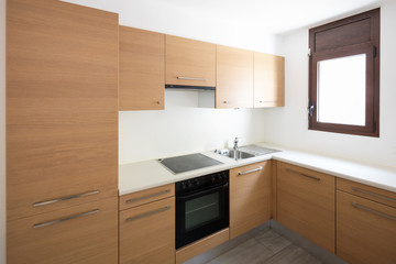 Modern kitchen in wood and white walls