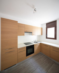 Modern kitchen in wood and white walls