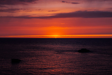Obraz premium background with red sunset over the sea, Etretat, Normandy, France