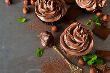 Chocolate cupcakes with peanut paste the old grunge background