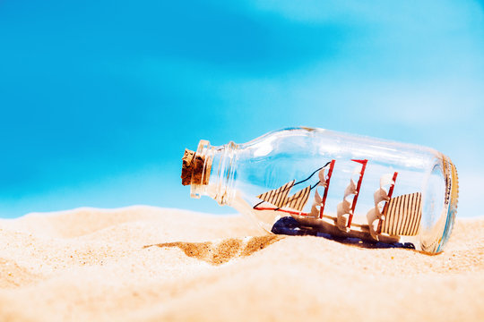 Ship in the bottle on the beach