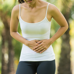 Woman Has Stomach Ache at Park