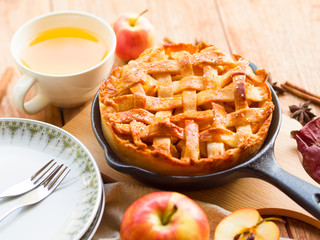 Homemade apple pie  pastry serve with hot tea on wooden table,bakery and dessert concept.