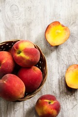 Fototapeta na wymiar Fresh Peaches in a a basket / Summer Fruits