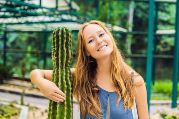 A woman hugs a cactus as her best friend. Problems of friendship concept