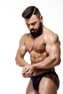 Handsome strong bodybuilder posing