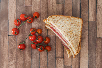 Wholemeal bread sandwich topped with Lyon rosette and butter