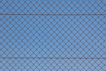 Metal fence and blue sky background