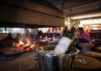 Wine bottle in ice bucket and space for text