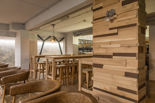 Wooden made furniture and decorations in hotel lobby bar interior