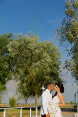 Fototapeta premium Romanic wedding couple posing in park
