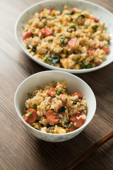Fried rice with egg and wood grain background