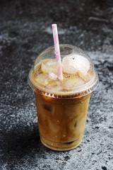 Iced latte to go on the dark backgroind. Iced coffee isolated 
