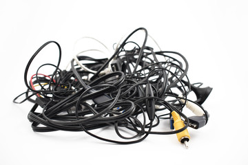 Tangled cables and connectors stock images. Tangle of cables on a white background. Plastic...